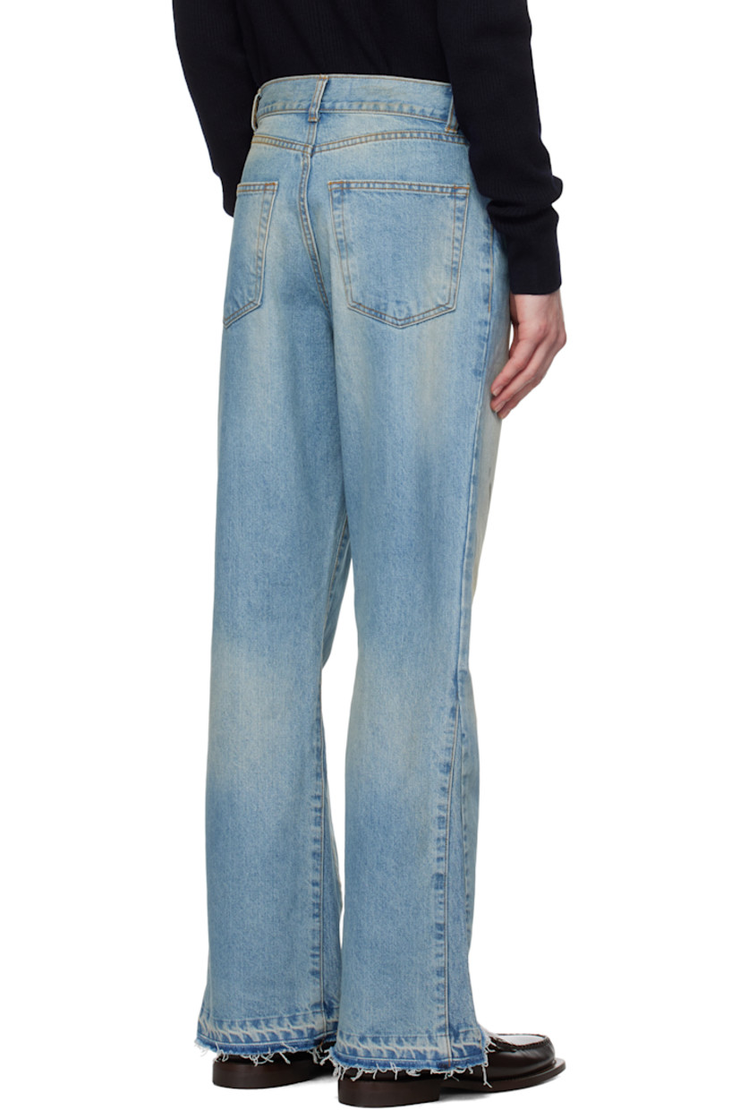 Flared non-stretch denim jeans. Fading, whiskering, and smudging throughout.

· Mid-rise
· Belt loops
· Five-pocket styling
· Zip fly
· Frayed edge at cuffs
· Gusset at outseams
· Silver-tone hardware
· Contrast stitching in tan

Supplier color: Washed light blue