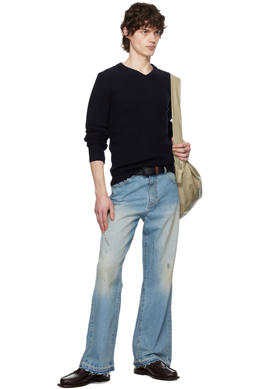 Flared non-stretch denim jeans. Fading, whiskering, and smudging throughout.

· Mid-rise
· Belt loops
· Five-pocket styling
· Zip fly
· Frayed edge at cuffs
· Gusset at outseams
· Silver-tone hardware
· Contrast stitching in tan

Supplier color: Washed light blue
