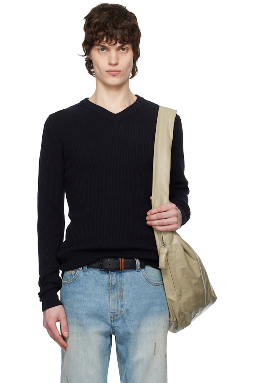 Rib-knit superfine merino wool sweater. 

· V-neck
· Central seam at back

Supplier color: Navy