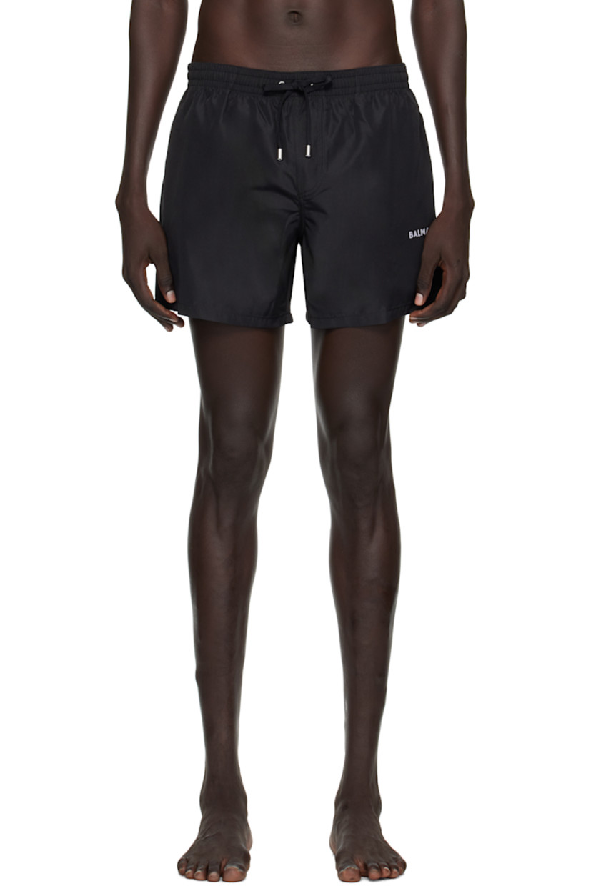 Taffeta swim shorts.

· Logo-woven drawstring at elasticized waistband
· Two-pocket styling
· Mock fly
· Logo embroidered at leg
· Integrated mesh briefs-style lining
· Logo-engraved silver-tone hardware

Supplier color: Black
