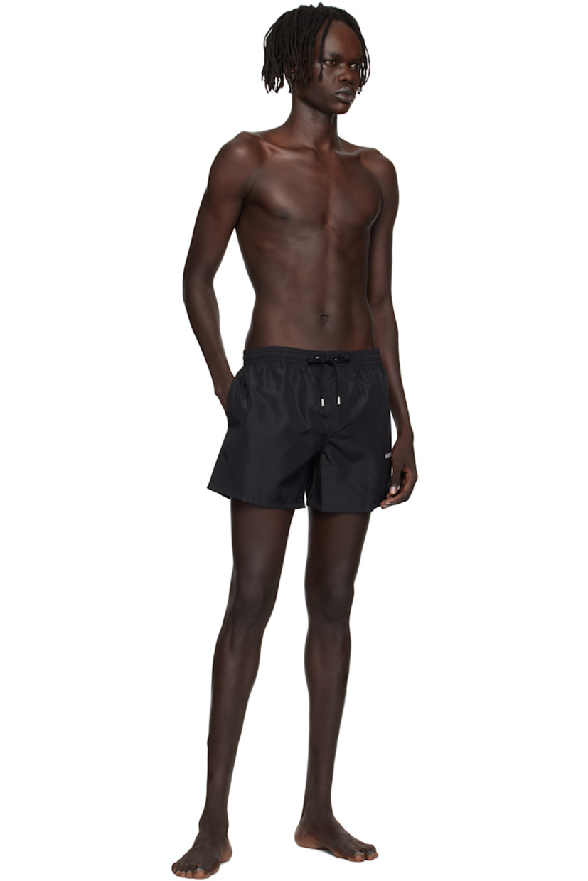 Taffeta swim shorts.

· Logo-woven drawstring at elasticized waistband
· Two-pocket styling
· Mock fly
· Logo embroidered at leg
· Integrated mesh briefs-style lining
· Logo-engraved silver-tone hardware

Supplier color: Black