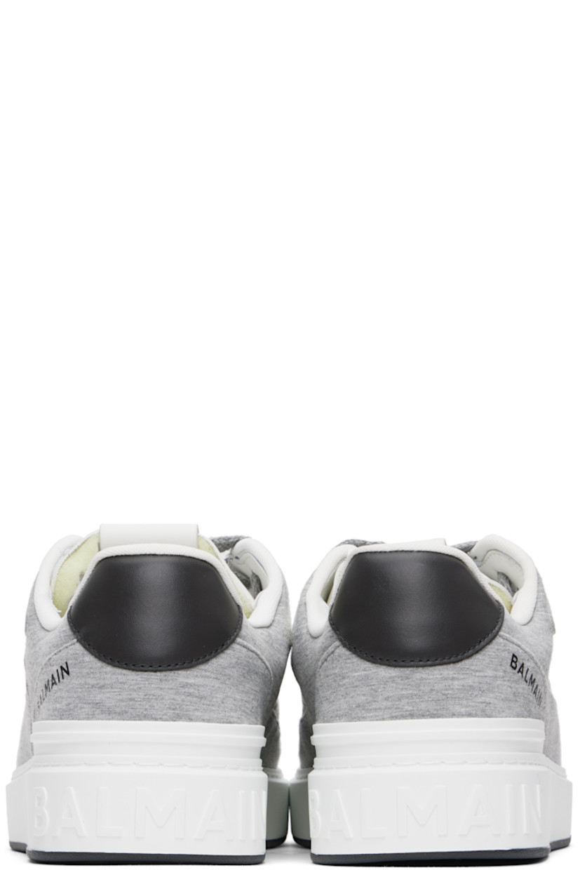 Low-top jersey and buffed calfskin sneakers in gray.

· Perforations at toe
· Lace-up closure
· Logo patch at padded tongue
· Padded collar
· Logos embossed at sides
· Logo printed at outer side
· Mesh lining
· Logo-embossed rubber midsole
· Treaded rubber sole

Supplier color: Grey