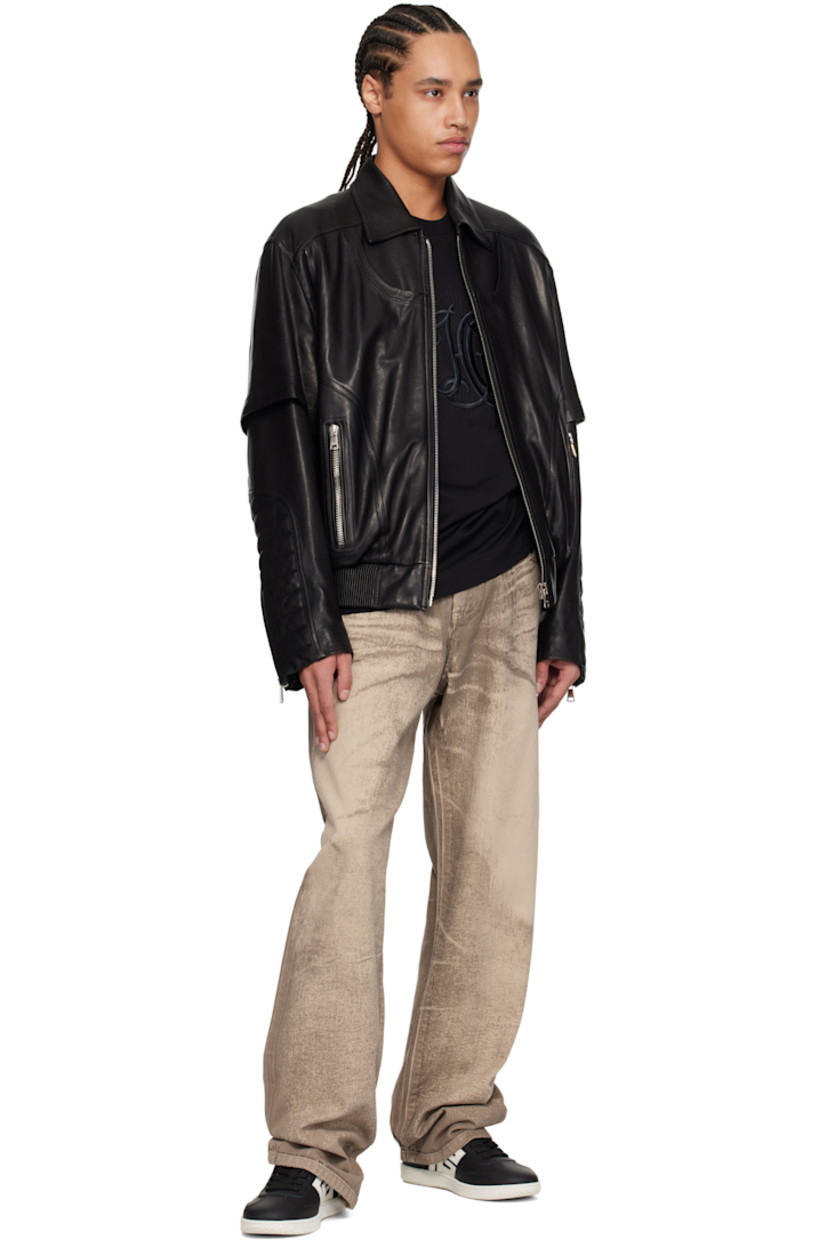 Low-top buffed calfskin sneakers in black.

· Lace-up closure
· Logo and graphics embossed at padded tongue
· Padded collar
· Logo appliqué at sides
· Serrated edges at sides and heel tab
· Logo embossed at outer side and heel tab
· Buffed calfskin and suede lining
· Logo embossed at textured rubber midsole
· Treaded rubber sole

Supplier color: Black