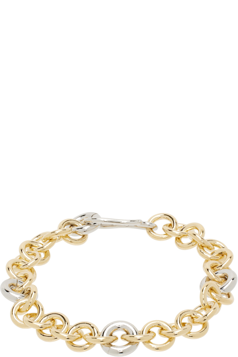 Cable chain bracelet in 14k gold-plated brass.

· Platinum-plated brass O-rings at length
· Hook-eye fastening
· L7"

Supplier color: Two tone
