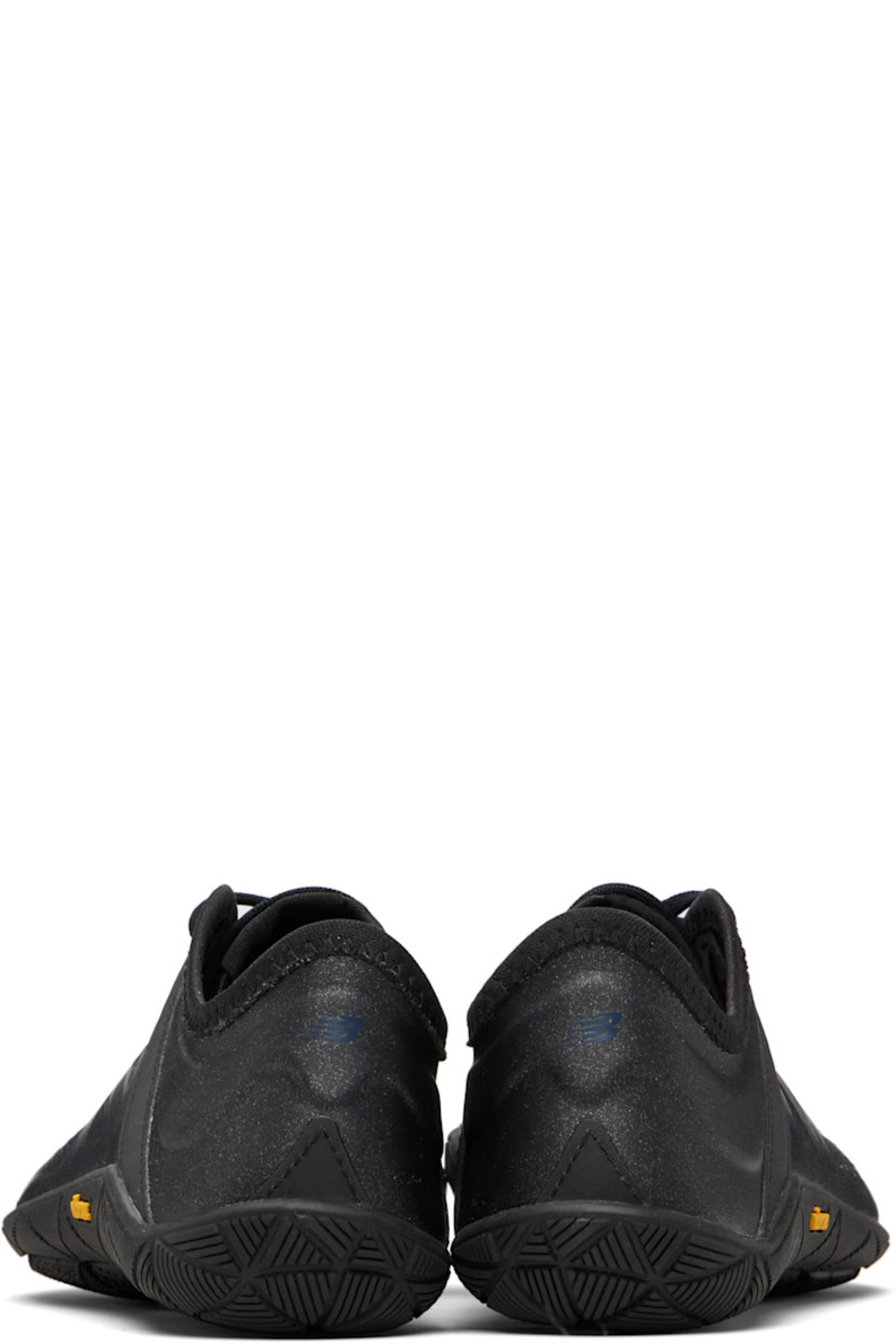 Low-top coated woven sneakers.

· Lace-up closure
· Perforations at tongue
· Logo printed at sides and heel tab
· Text printed at outer side
· Treaded Vibram® rubber sole

Part of the Junya Watanabe x New Balance collaboration.

Supplier color: Black