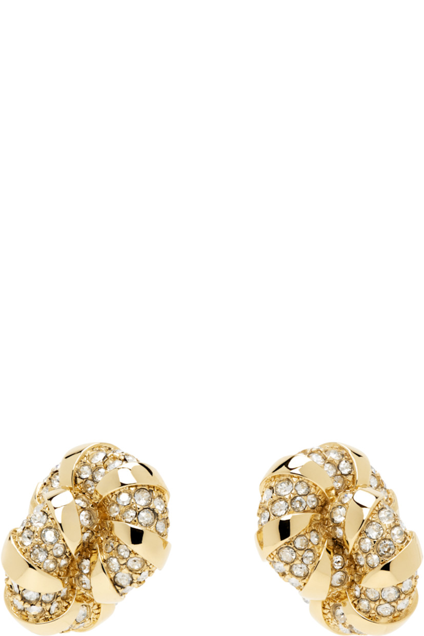 Pair of stud earrings in gold-tone brass. Hand-set pavé glass crystals throughout.

· Post-stud fastening
· H1" x W0.75"

Supplier color: Gold/Crystal