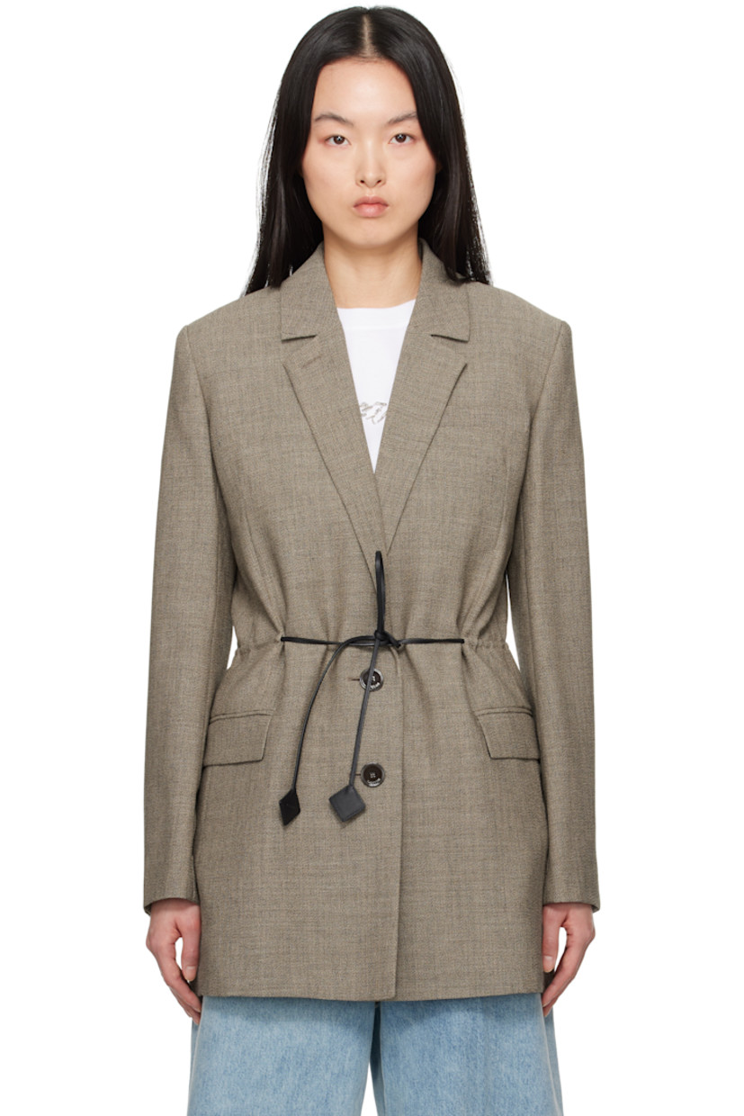 Plain-woven virgin wool blazer.

· Button fastening at notched lapel 
· Two-button closure 
· Self-tie fastening at front
· Welt pocket and flap pockets
· Padded shoulders
· Button fastening at vented cuffs 
· Central vent at back hem
· Partial bemberg lining

Supplier color: Lin