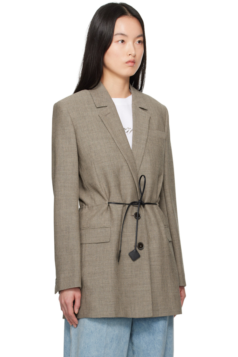 Plain-woven virgin wool blazer.

· Button fastening at notched lapel 
· Two-button closure 
· Self-tie fastening at front
· Welt pocket and flap pockets
· Padded shoulders
· Button fastening at vented cuffs 
· Central vent at back hem
· Partial bemberg lining

Supplier color: Lin
