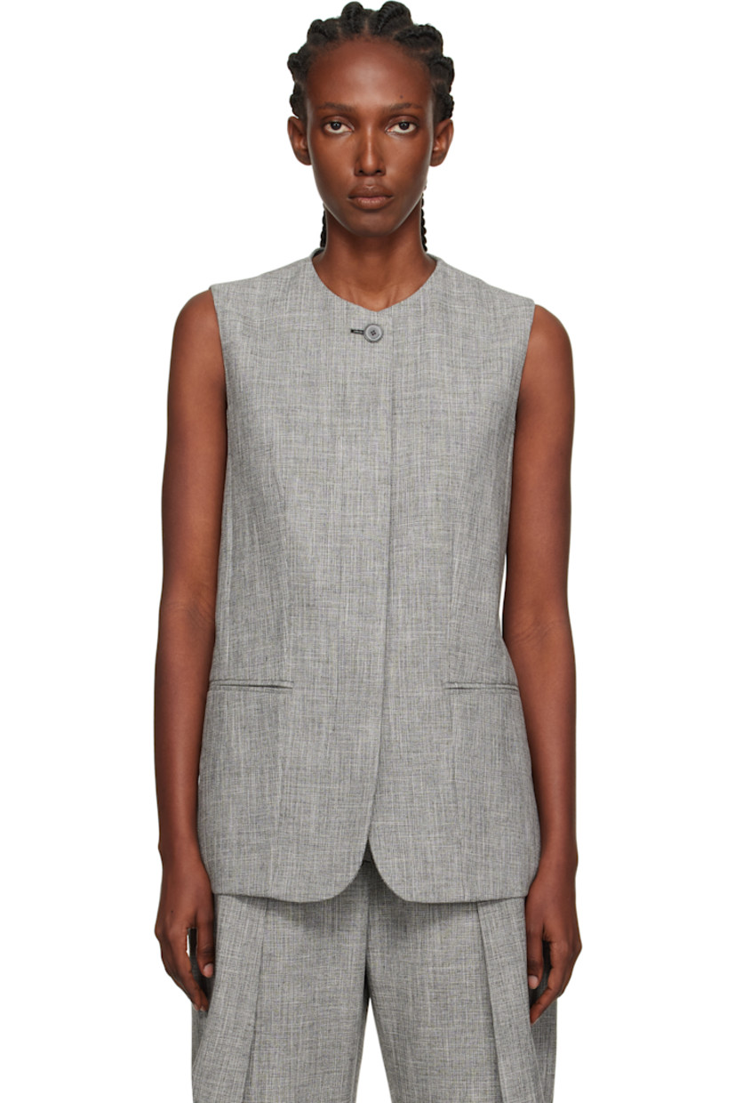 Viscose- and cotton-blend tweed vest. 

· Crewneck
· Button closure
· Darts at front
· Welt pockets 
· Partial twill lining

Supplier color: Heather grey