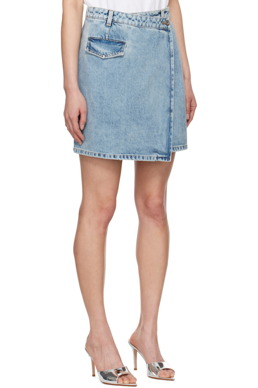 Non-stretch denim miniskirt. Fading throughout.

· Wrap construction
· Belt loops
· Single-pocket styling
· Button fastening at waist
· Leather logo patch at back waistband 
· Darts at back
· Logo-engraved silver-tone hardware
· Contrast stitching in tan

Supplier color: Light blue