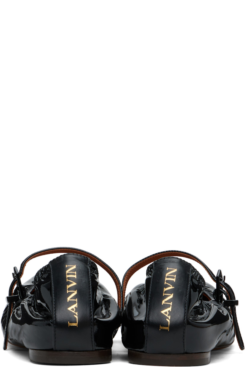 Patent calfskin ballerina flats in black. 

· Elasticized collar 
· Pin-buckle strap at vamp
· Gold-tone logo stamp at heel counter 
· Buffed leather and suede lining 
· Suede sole with rubber injection 

Supplier color: Black
