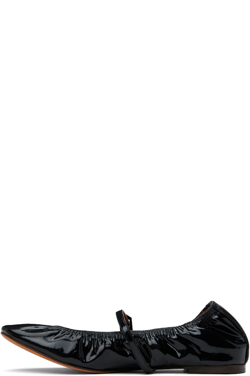 Patent calfskin ballerina flats in black. 

· Elasticized collar 
· Pin-buckle strap at vamp
· Gold-tone logo stamp at heel counter 
· Buffed leather and suede lining 
· Suede sole with rubber injection 

Supplier color: Black
