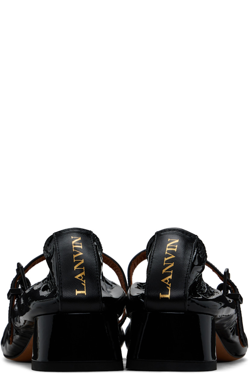 Patent calfskin Mary Jane-style heels in black.

· Pin-buckle strap at vamp
· Gathering at elasticized collar
· Logo stamp at heel tab
· Buffed goatskin lining
· Covered block heel with rubber injection
· Leather sole
· Heel: H1.25"

Supplier color: Black