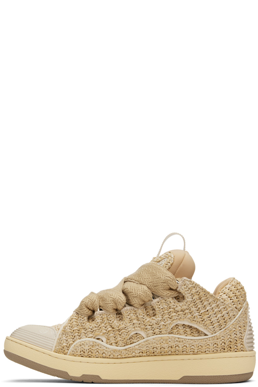 Low-top woven faux-raffia and grained calfskin sneakers in beige.

· Piping, cutouts, and rubberized trim throughout
· Logo embossed at toe
· Lace-up closure
· Logo plaque and pull-loop at tongue
· Padded tongue and collar
· Jersey lining
· Treaded rubber sole

Supplier color: Natural