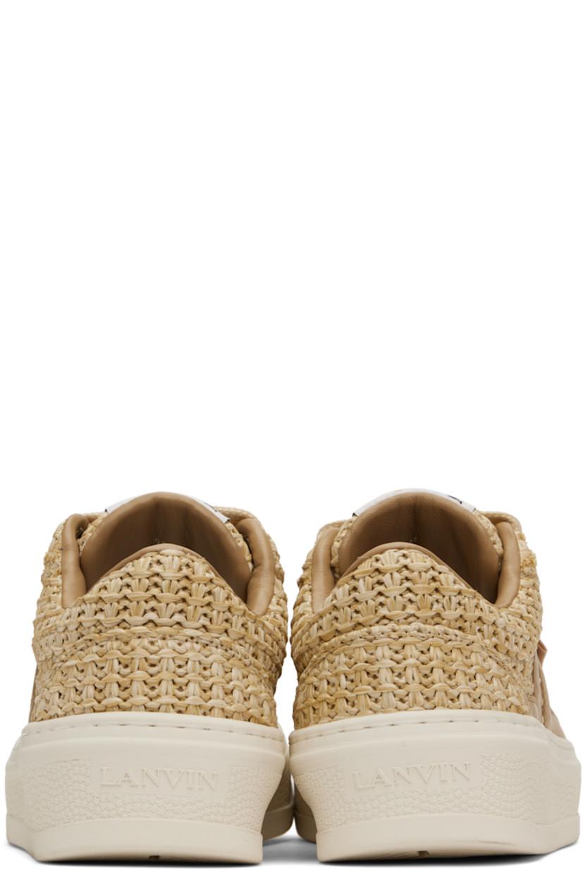 Low-top woven faux-raffia sneakers in beige.

· Lace-up closure
· Logo patch at padded tongue
· Padded collar
· Buffed calfskin logo appliqués at sides
· Logo flag at outer side
· Logo embossed at heel 
· Grained calfskin lining
· Treaded rubber sole

Supplier color: Natural