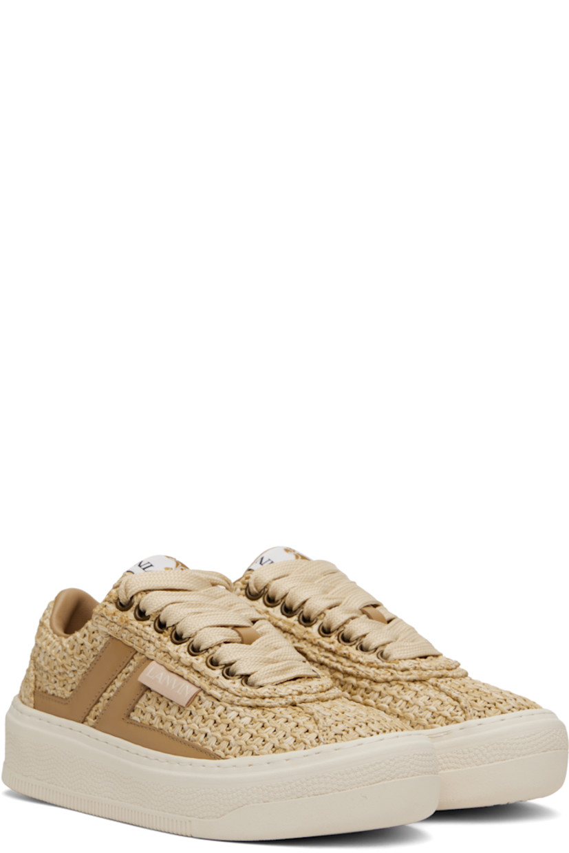 Low-top woven faux-raffia sneakers in beige.

· Lace-up closure
· Logo patch at padded tongue
· Padded collar
· Buffed calfskin logo appliqués at sides
· Logo flag at outer side
· Logo embossed at heel 
· Grained calfskin lining
· Treaded rubber sole

Supplier color: Natural