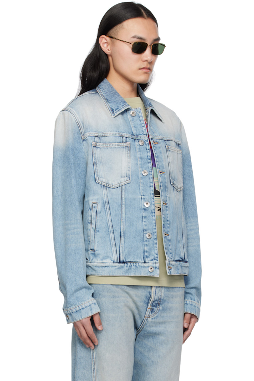 Non-stretch denim jacket. Fading, whiskering, and subtle distressing throughout.

· Spread collar
· Button closure
· Patch and welt pockets
· Single-button barrel cuffs
· Adjustable button tabs at back hem
· Calfskin logo patch at back hem
· Logo-engraved silver-tone hardware
· Contrast stitching in tan

Supplier color: Light blue