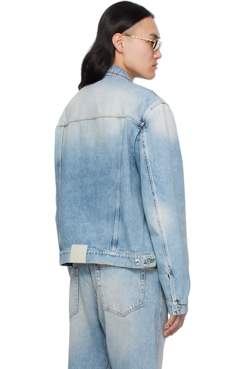 Non-stretch denim jacket. Fading, whiskering, and subtle distressing throughout.

· Spread collar
· Button closure
· Patch and welt pockets
· Single-button barrel cuffs
· Adjustable button tabs at back hem
· Calfskin logo patch at back hem
· Logo-engraved silver-tone hardware
· Contrast stitching in tan

Supplier color: Light blue