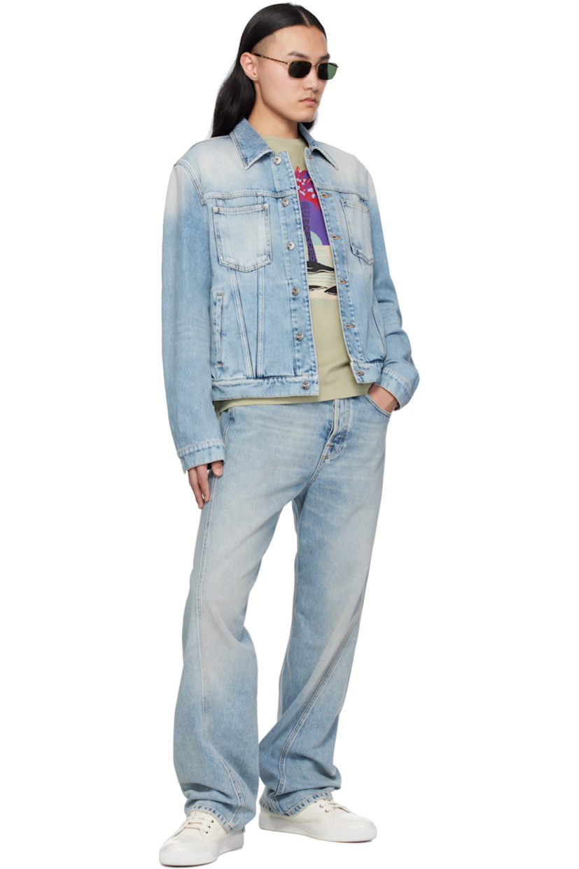 Non-stretch denim jacket. Fading, whiskering, and subtle distressing throughout.

· Spread collar
· Button closure
· Patch and welt pockets
· Single-button barrel cuffs
· Adjustable button tabs at back hem
· Calfskin logo patch at back hem
· Logo-engraved silver-tone hardware
· Contrast stitching in tan

Supplier color: Light blue