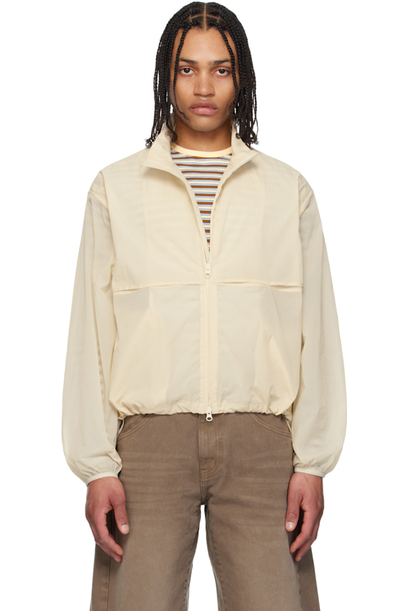 Semi-sheer crinkled nylon taffeta jacket. 

· Stand collar
· Two-way zip closure
· Storm flap at front and back 
· Seam pockets
· Bungee-style drawstring at cropped hem 
· Elasticized cuffs

Supplier color: Cream