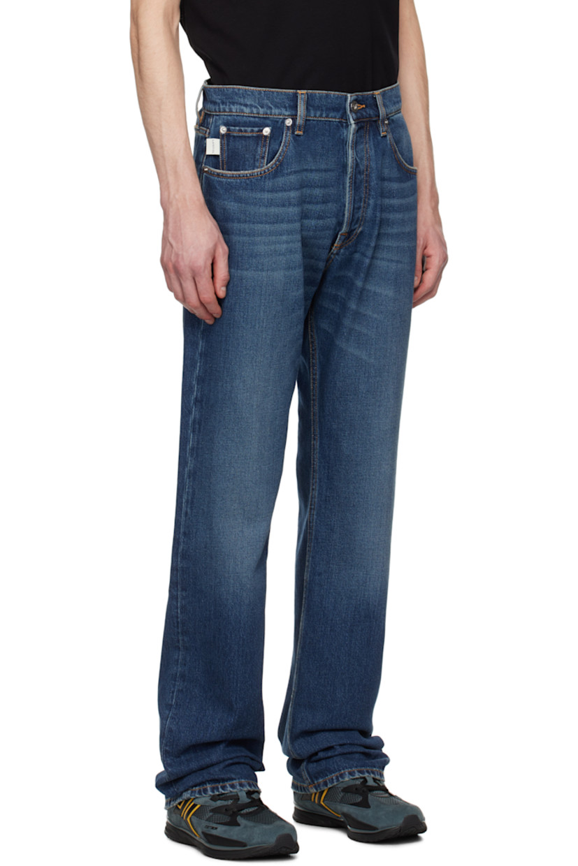 Straight-leg non-stretch denim jeans. Fading and whiskering throughout.

· Belt loops
· Five-pocket styling
· Button-fly
· Logo flag at coin pocket
· Leather logo patch at back waistband 
· Logo-engraved silver-tone hardware
· Contrast stitching in tan

Supplier color: Medium blue