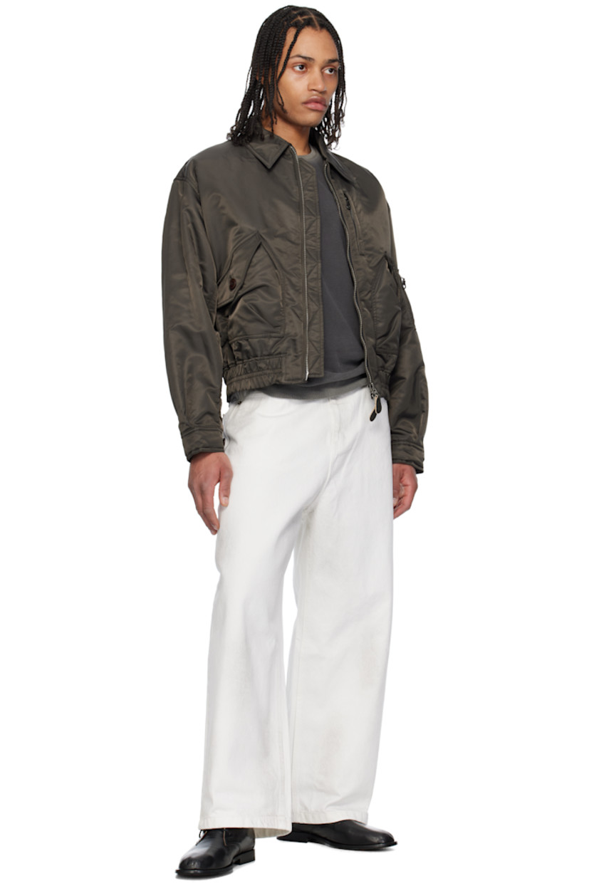 Wide-leg non-stretch denim jeans. Smudging throughout.

· Belt loops
· Five-pocket styling
· Zip fly
· Logo patch at back waistband

Supplier color: Vintage white