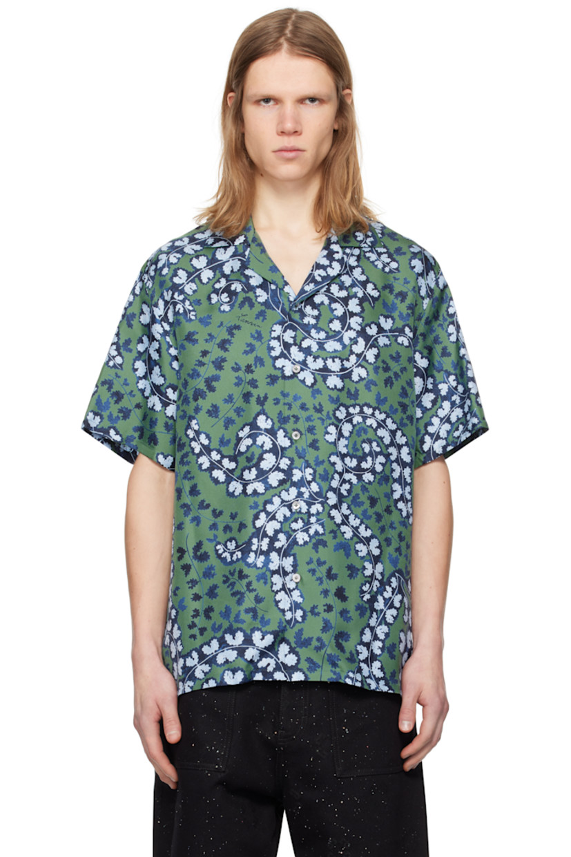 Silk twill shirt. Floral pattern and logos printed throughout.

· Open spread collar
· Button closure
· Logo-engraved mother-of-pearl hardware

Supplier color: Meleze