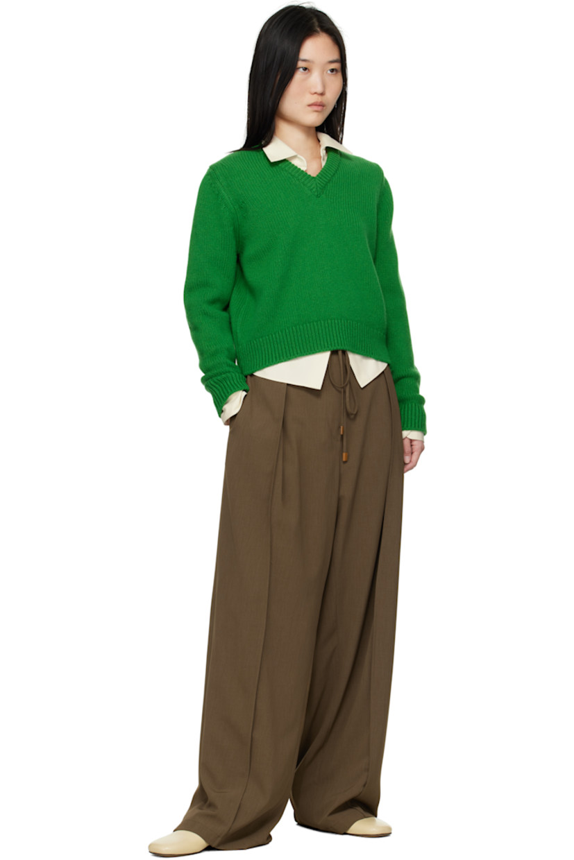 5-gauge knit RWS-certified Geelong lambswool sweater. 

· Pre-shrunk
· Rib-knit V-neck, hem, and cuffs

Supplier color: Pagoda green