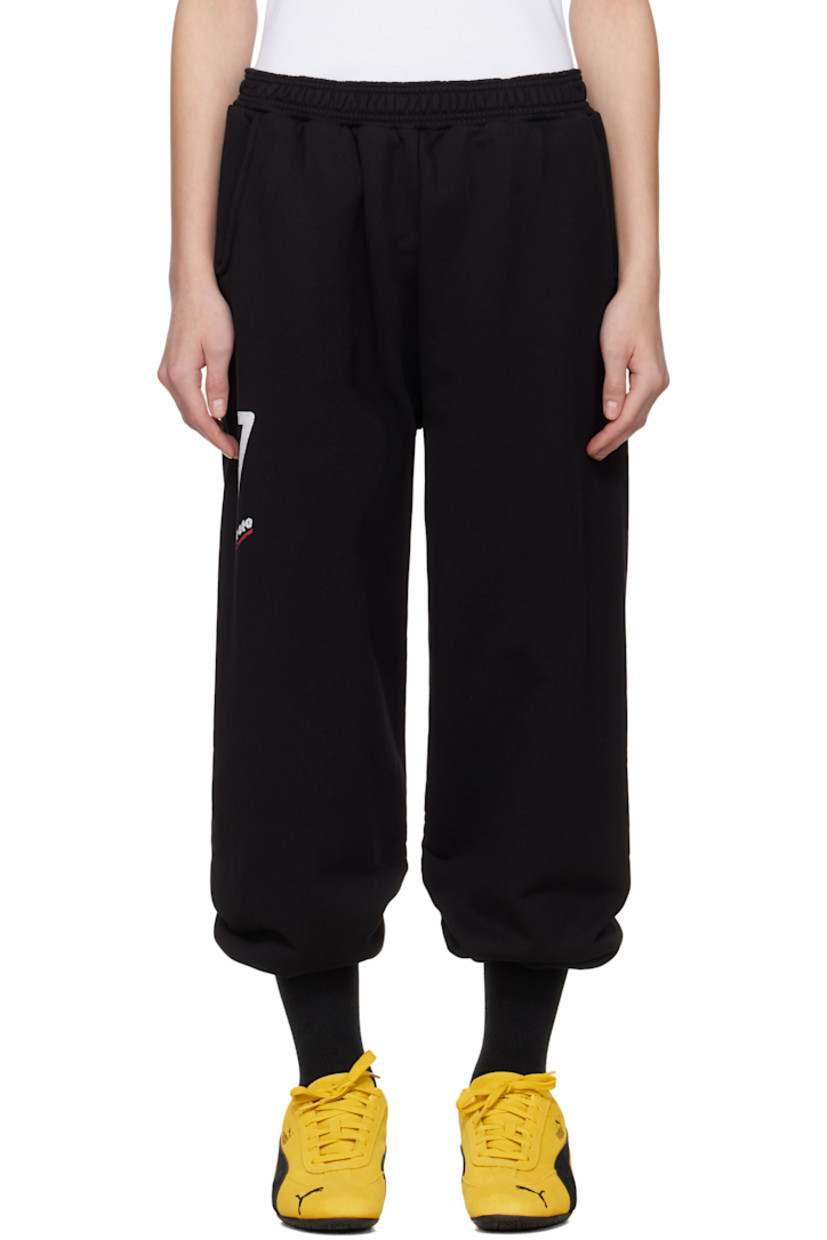 Upcycled French terry lounge pants.

· Concealed drawstring at elasticized waistband
· Two-pocket styling
· Logo and text printed at leg
· Cropped legs
· Raw edge at cuffs
· Logo flag at back waistband

Each item is unique. Please note coloration and finishings may vary.

Supplier color: Black molleton