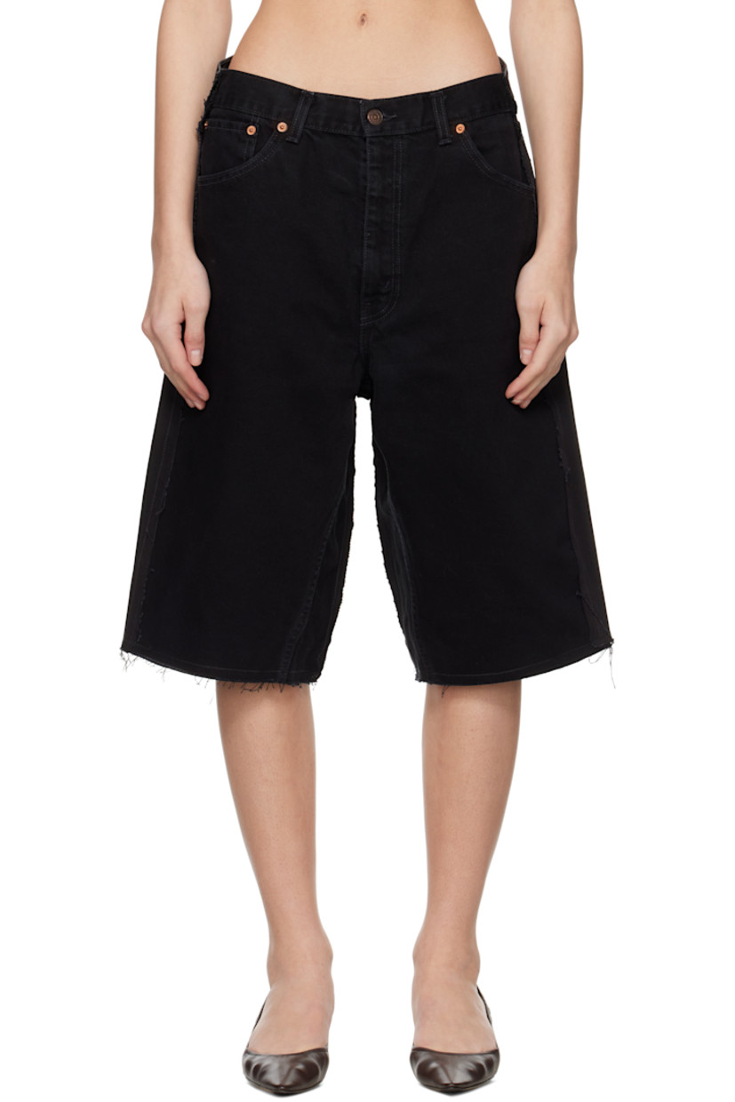 Upcycled non-stretch denim shorts. Fading and raw edges throughout.

· Paneled construction
· Belt loops
· Five-pocket styling
· Zip fly
· Logo flag at back pocket

Each item is unique. Please note coloration and finishings may vary.

Supplier color: Upcycled denim black
