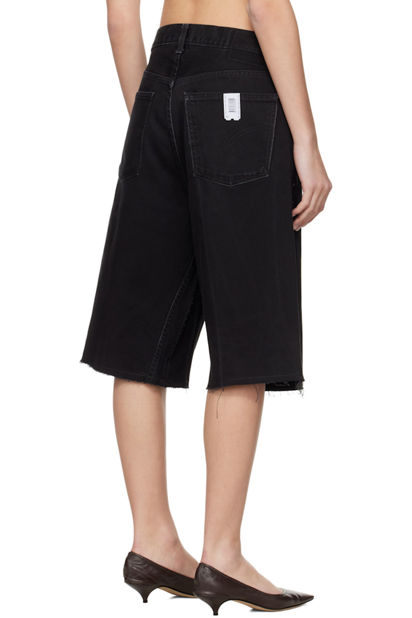 Upcycled non-stretch denim shorts. Fading and raw edges throughout.

· Paneled construction
· Belt loops
· Five-pocket styling
· Zip fly
· Logo flag at back pocket

Each item is unique. Please note coloration and finishings may vary.

Supplier color: Upcycled denim black