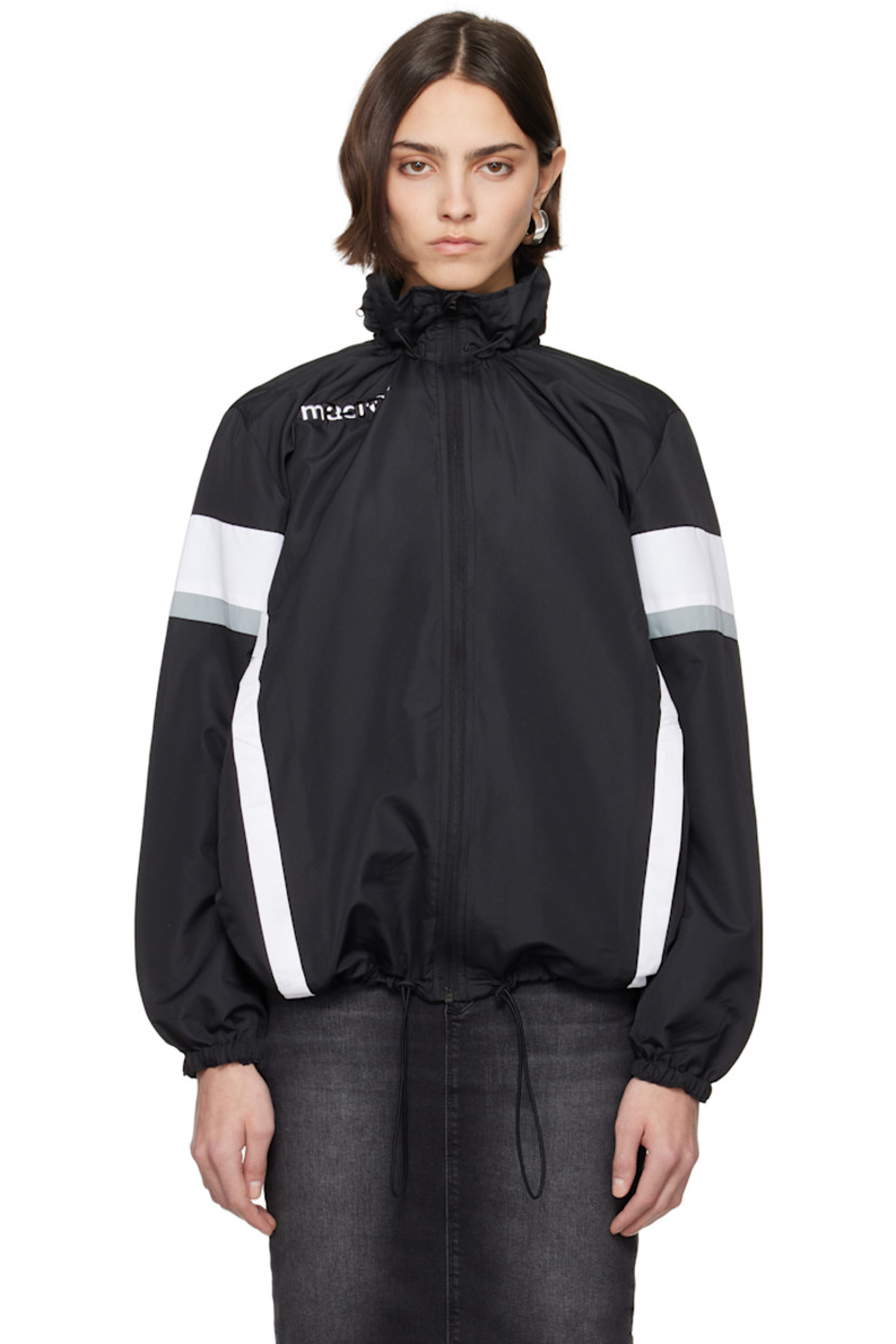 Upcycled polyester ripstop jacket. Stripes throughout. 

· Elasticized stowaway hood
· Bungee-style drawstring at stand collar and hem
· Zip closure
· Zip pockets
· Raglan sleeves
· Elasticized cuffs
· Logo flag at back collar
· Open back

Each item is unique. Please note coloration and finishings may vary.

Supplier color: Nylon track black