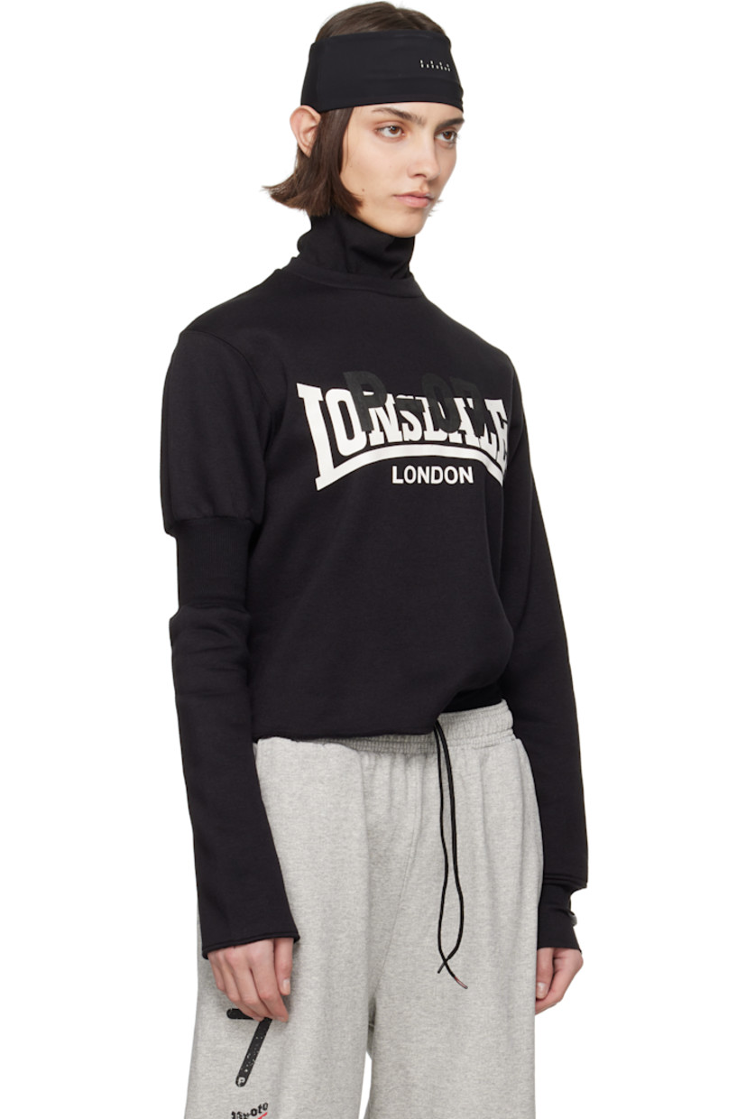 Upcycled cotton-blend fleece turtleneck.

· Rib-knit collar and cuff
· Logo and text printed at front
· Raw edge at hem and cuff
· Rib-knit panel at sleeve
· Logo flag at cuff and back collar

Each item is unique. Please note coloration and finishings may vary.

Supplier color: Upcycled crewneck black
