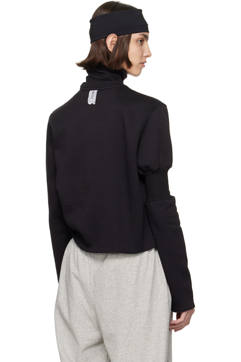 Upcycled cotton-blend fleece turtleneck.

· Rib-knit collar and cuff
· Logo and text printed at front
· Raw edge at hem and cuff
· Rib-knit panel at sleeve
· Logo flag at cuff and back collar

Each item is unique. Please note coloration and finishings may vary.

Supplier color: Upcycled crewneck black