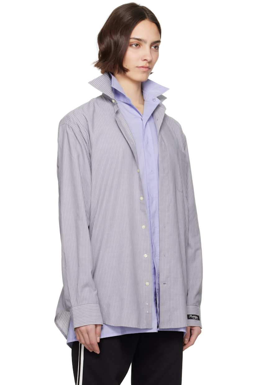 Upcycled cotton oxford cloth shirt. Stripes throughout. 

· Layered construction
· Spread collar
· Button closure
· Patch pocket at chest
· Shirttail hem 
· Logo patch at cuff
· Pleats at buttoned barrel cuffs
· Logo flag at back collar
· Twin pleats at back yoke 

Each item is unique. Please note coloration and finishings may vary.

Supplier color: Mixed colours