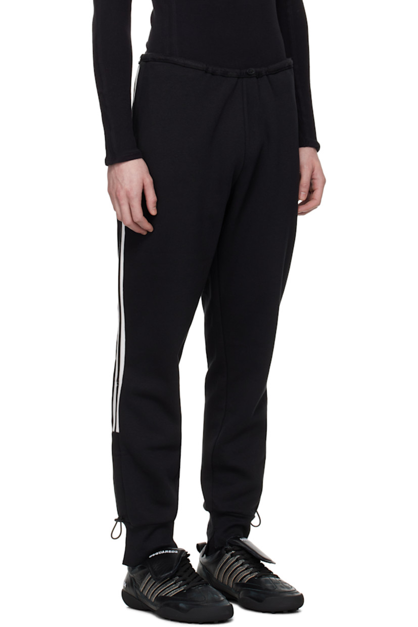 Upcycled cotton-blend fleece track pants.

· Bungee-style drawstring at elasticized waistband
· Two-pocket styling
· Logo patch at pocket
· Logo printed at front
· Bungee-style drawstring at vented cuffs
· Striped knit trim at outseams
· Logo flag at back waistband

Each item is unique. Please note coloration and finishings may vary.

Supplier color: Upcycled trackpants