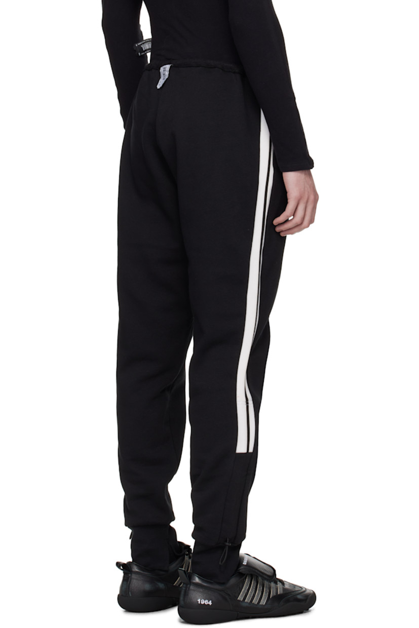 Upcycled cotton-blend fleece track pants.

· Bungee-style drawstring at elasticized waistband
· Two-pocket styling
· Logo patch at pocket
· Logo printed at front
· Bungee-style drawstring at vented cuffs
· Striped knit trim at outseams
· Logo flag at back waistband

Each item is unique. Please note coloration and finishings may vary.

Supplier color: Upcycled trackpants