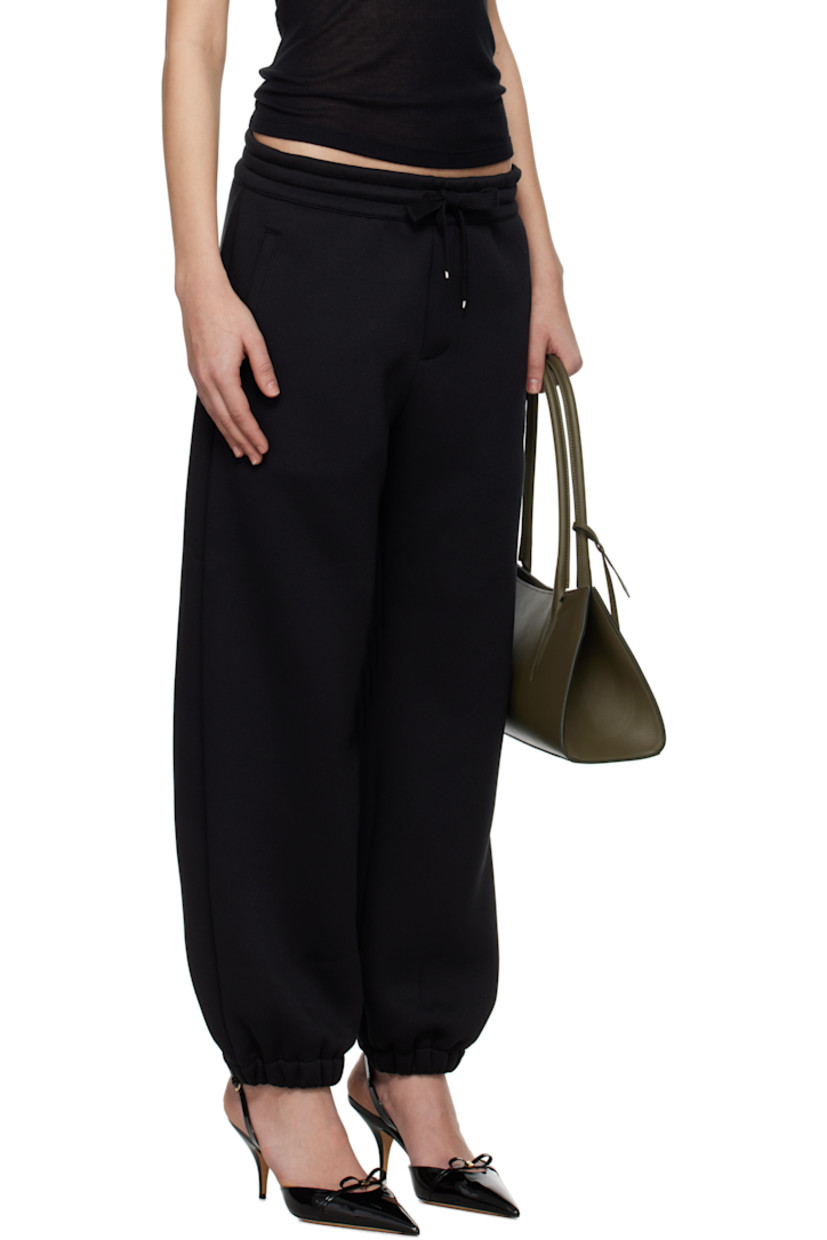 Polyester jersey lounge pants. 

· Drawstring at elasticized waistband
· Two-pocket styling
· Logo graphic embroidered at front
· Elasticized cuffs

Supplier color: Black