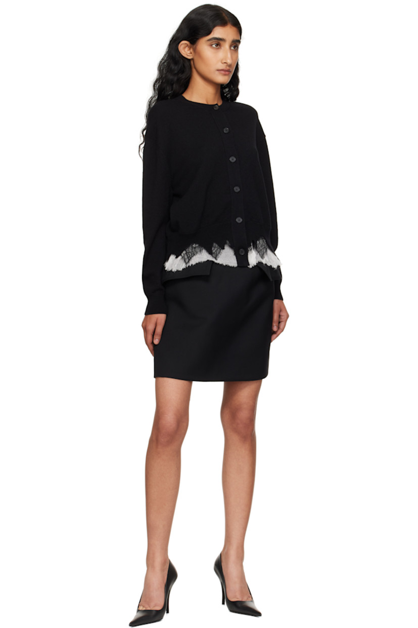 Wool gabardine miniskirt. 

· Two-pocket styling
· Mock flap pockets at front 
· Concealed zip closure at back 
· Full crêpe lining 

Supplier color: Black