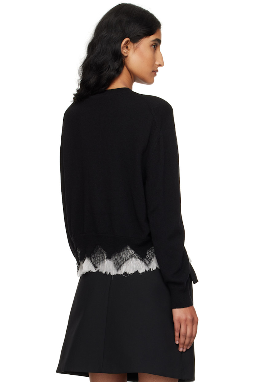 Knit wool- and cashmere-blend cardigan.

· Pre-shrunk 
· Rib-knit crewneck, hem, and cuffs
· Button closure
· Lace and silk crepon trim with raw edges at hem 

Supplier color: Black