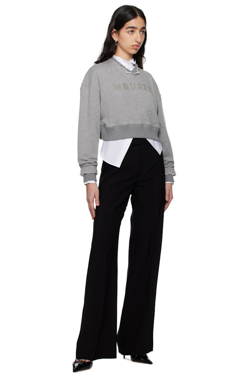 French terry sweatshirt.

· Frayed edge at rib-knit crewneck and cuffs
· Hand-embroidered logo appliqué at chest
· Rib-knit cropped hem
· Dropped shoulders

Supplier color: Grey melange