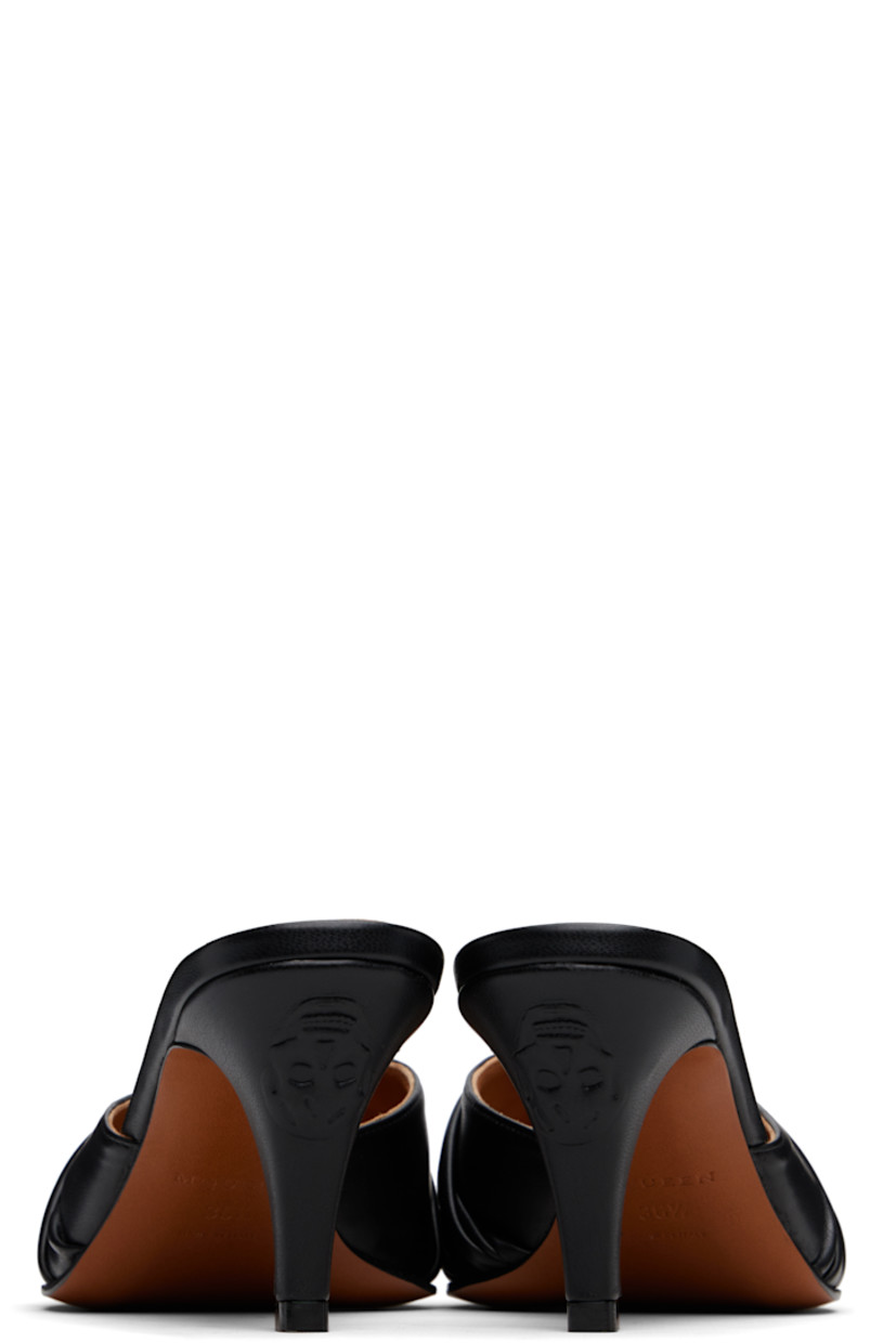 Stretch faux-leather mules in black.

· Pointed toe
· Ruching at vamp
· Logo graphic-embossed covered stiletto heel
· Polished leather sole with rubber injections
· Heel: H2.75"

Supplier color: Black