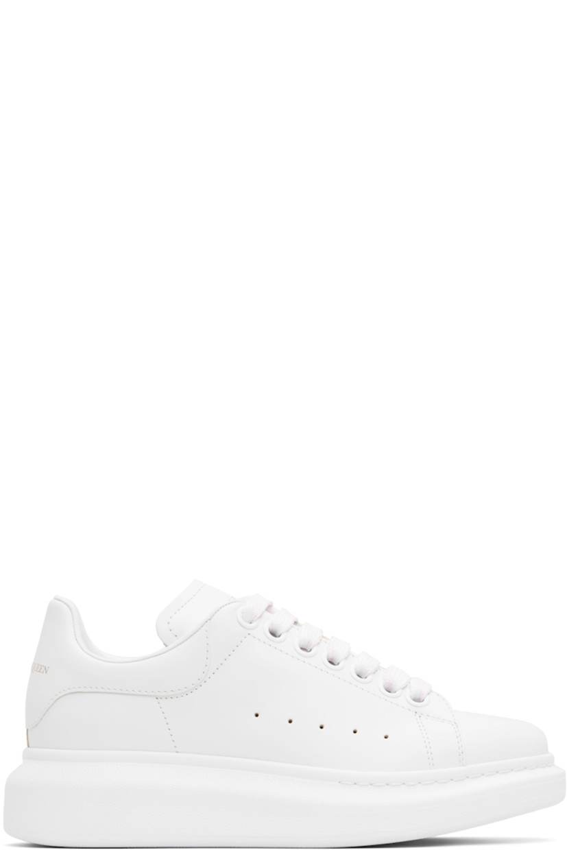Low-top buffed calfskin sneakers in white.

· Lace-up closure
· Gold-tone logo stamp at tongue and heel tab
· Padded tongue and collar
· Perforations at sides
· Textured rubber midsole
· Treaded rubber sole

Supplier color: White