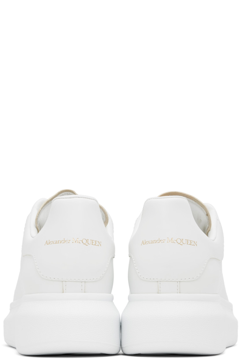 Low-top buffed calfskin sneakers in white.

· Lace-up closure
· Gold-tone logo stamp at tongue and heel tab
· Padded tongue and collar
· Perforations at sides
· Textured rubber midsole
· Treaded rubber sole

Supplier color: White