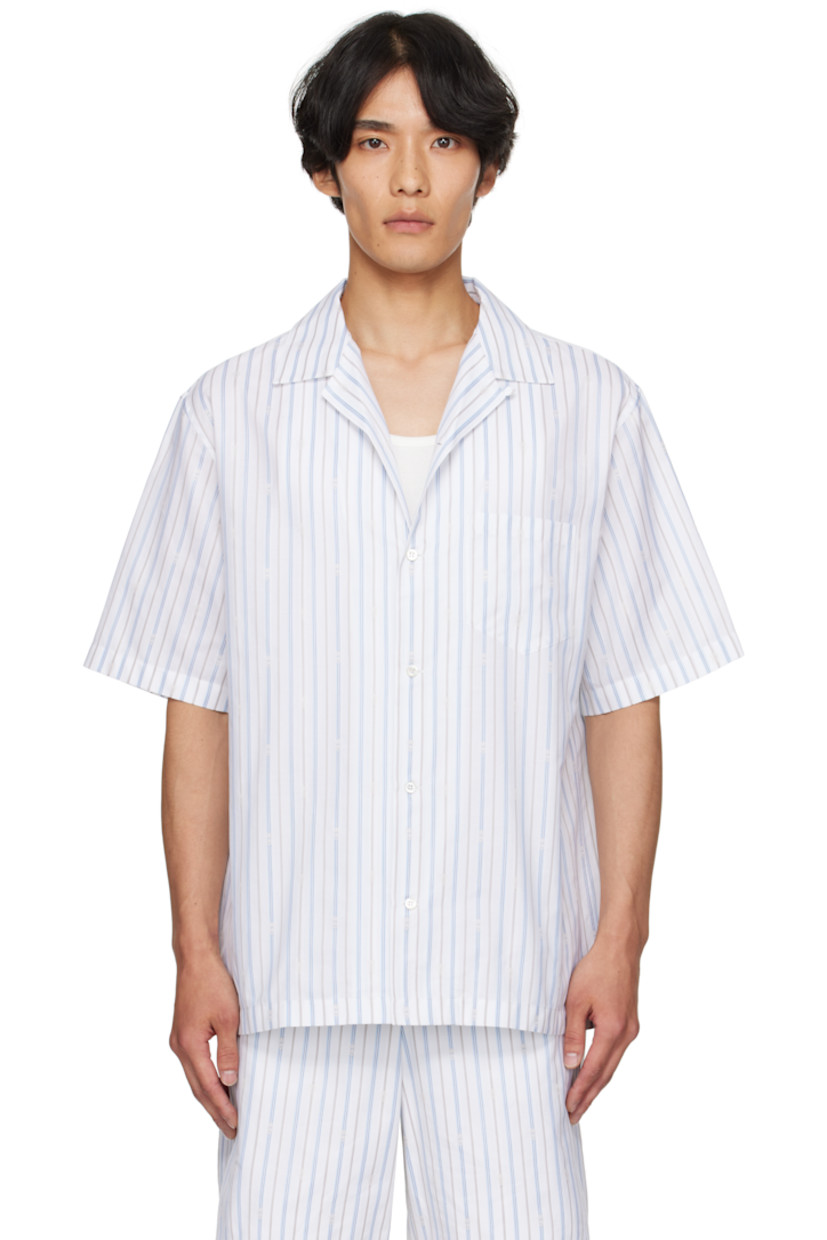 Cotton poplin shirt.

· Striped logo pattern throughout
· Open spread collar
· Button closure
· Patch pocket at chest
· Vented side seams
· Twin pleats at back yoke
· Mother-of-pearl hardware

Supplier color: White/Blue/Grey