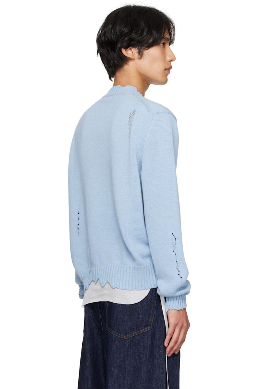 Knit cotton sweater.

· Distressing and laddering throughout
· Rib-knit crewneck, hem, and cuffs
· Distressed graphic at front
· Dropped shoulders

Supplier color: Shirting blue