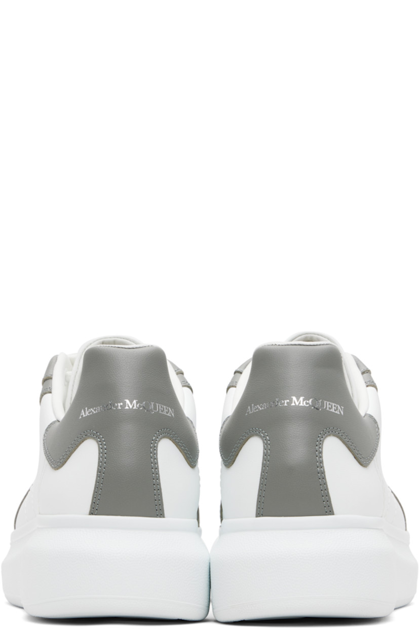 Low-top paneled buffed calfskin sneakers.

· Lace-up closure
· Logo embossed at tongue
· Padded tongue and collar
· Logo printed at heel tab
· Treaded rubber sole
· Includes additional laces

Supplier color: Off white/Cool grey
