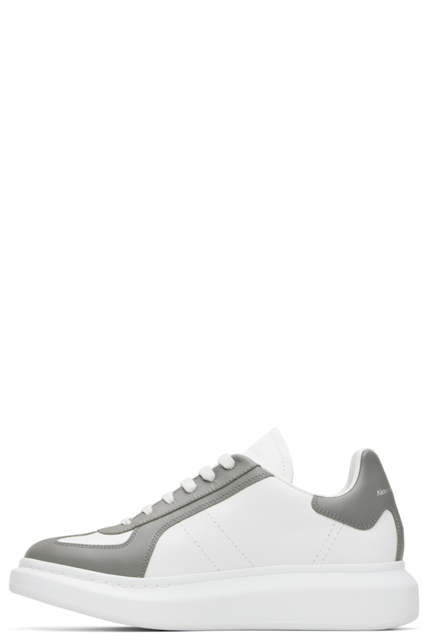 Low-top paneled buffed calfskin sneakers.

· Lace-up closure
· Logo embossed at tongue
· Padded tongue and collar
· Logo printed at heel tab
· Treaded rubber sole
· Includes additional laces

Supplier color: Off white/Cool grey