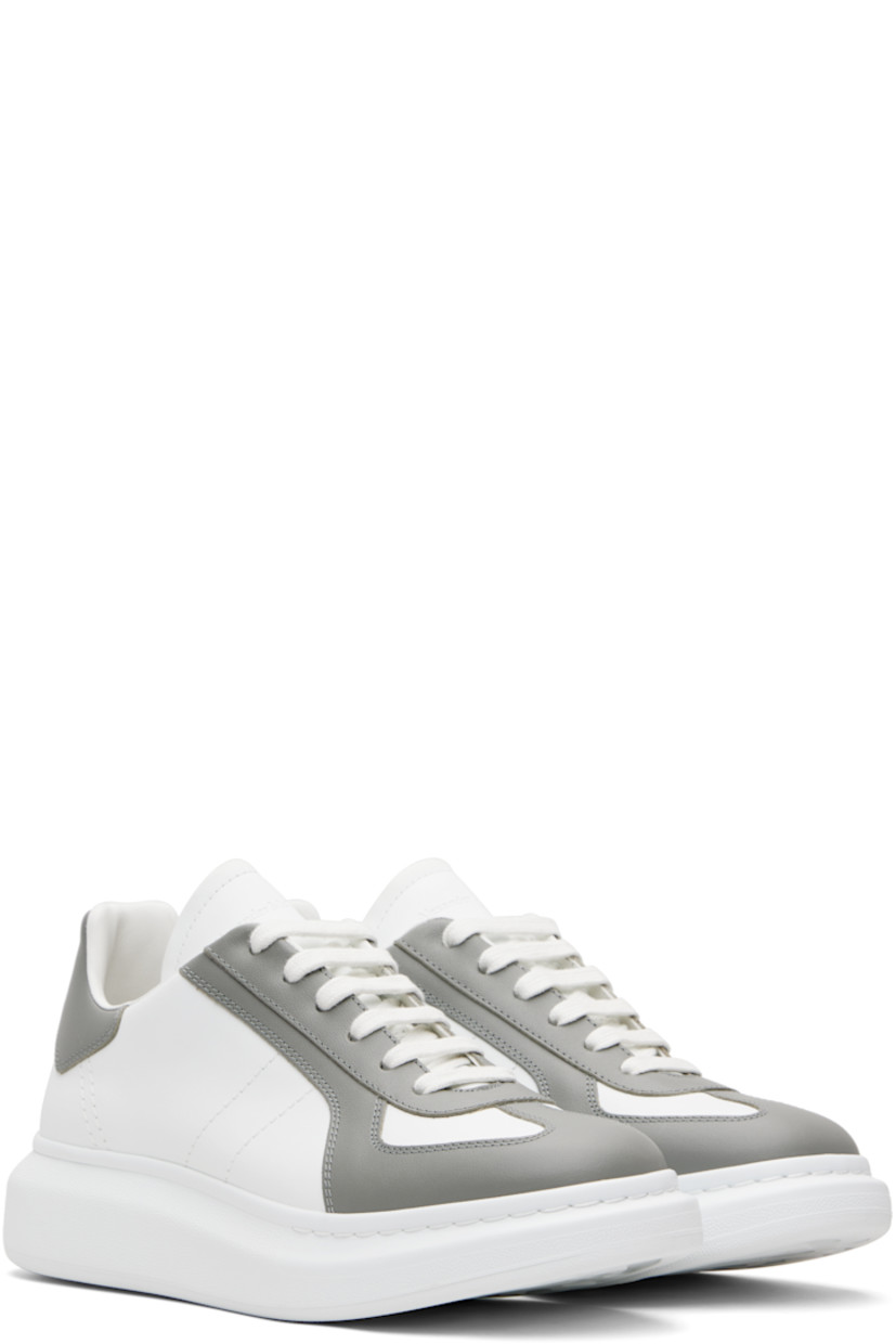 Low-top paneled buffed calfskin sneakers.

· Lace-up closure
· Logo embossed at tongue
· Padded tongue and collar
· Logo printed at heel tab
· Treaded rubber sole
· Includes additional laces

Supplier color: Off white/Cool grey