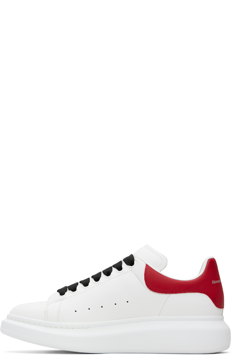 Low-top buffed calfskin sneakers.

· Lace-up closure
· Logo printed at tongue
· Padded tongue and collar
· Perforations at sides
· Logo printed at polished calfskin heel tab
· Treaded rubber sole
· Includes additional laces

Supplier color: Off white/Red